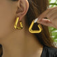 Radiant Triangle gold earrings